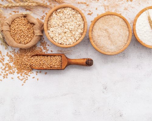 wheat-flour-wooden-bowl-set-up-white-concrete-background (1)